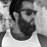Photo-by-Joaquim-Lopes-on-January-20-2023.-May-be-a-black-and-white-image-of-one-or-more-people-beard-eyewear-and-tanktop.